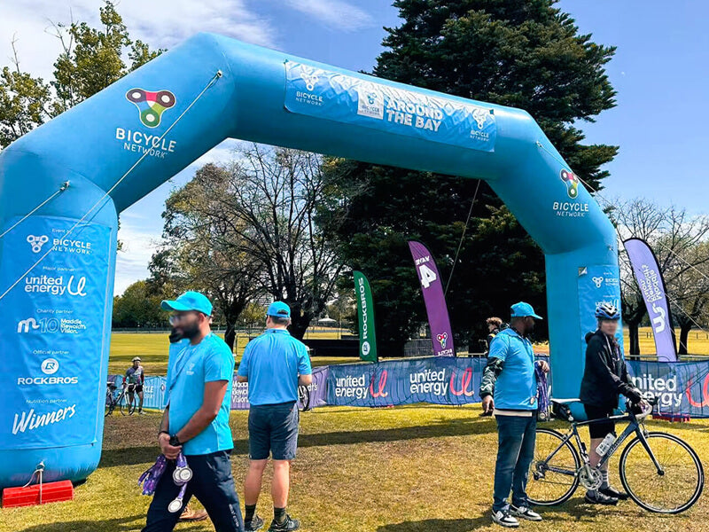 Cyclists riding through the rain during the 2025 United Energy Around the Bay event in Melbourne.