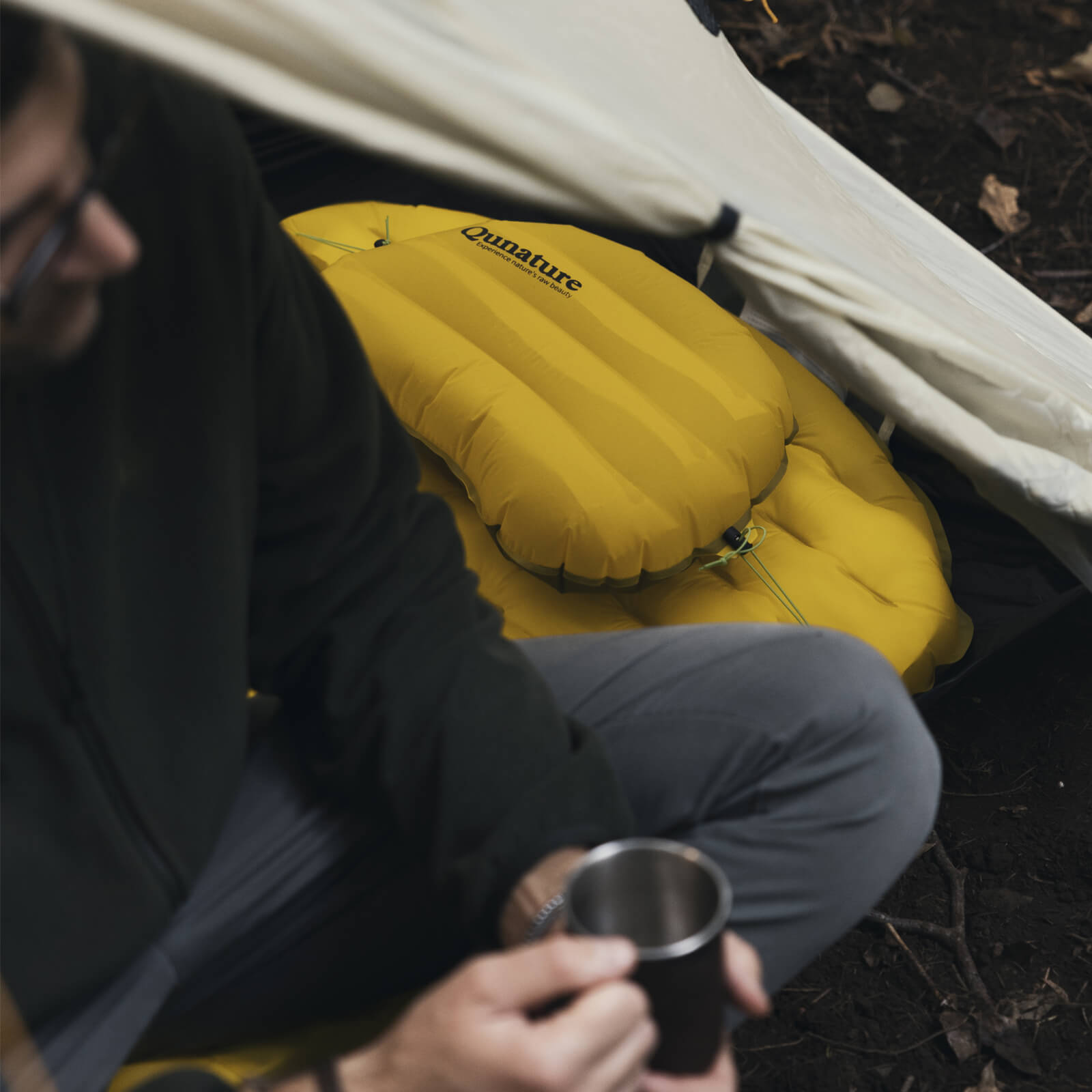 Camping equipment with tents, sleeping bags, and outdoor cooking gear.