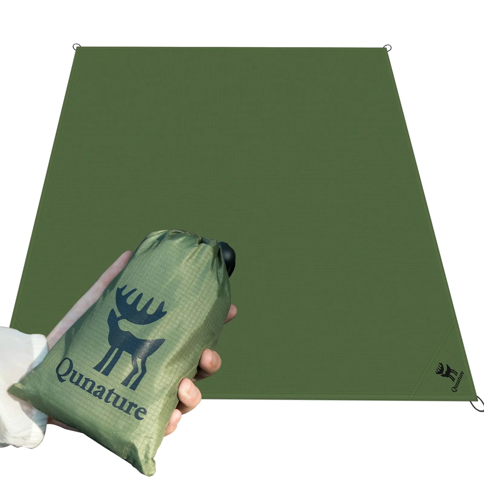 qunature sandproof beach blanket being used by a family on the sand, oversized and portable for seaside travel.
#color_green