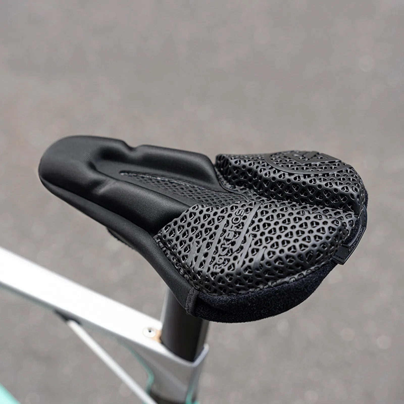ROCKBROS 3D printed bicycle seat covers feature a black elastomer honeycomb structure design, showcasing a lightweight and technologically advanced look.