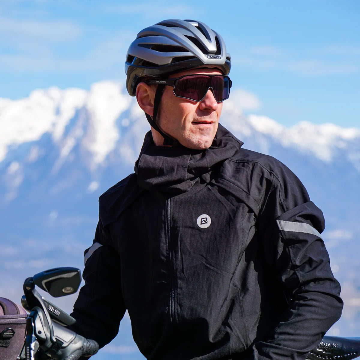 Black ROCKBROS convertible cycling jacket with long sleeves, hood and reflective arm details