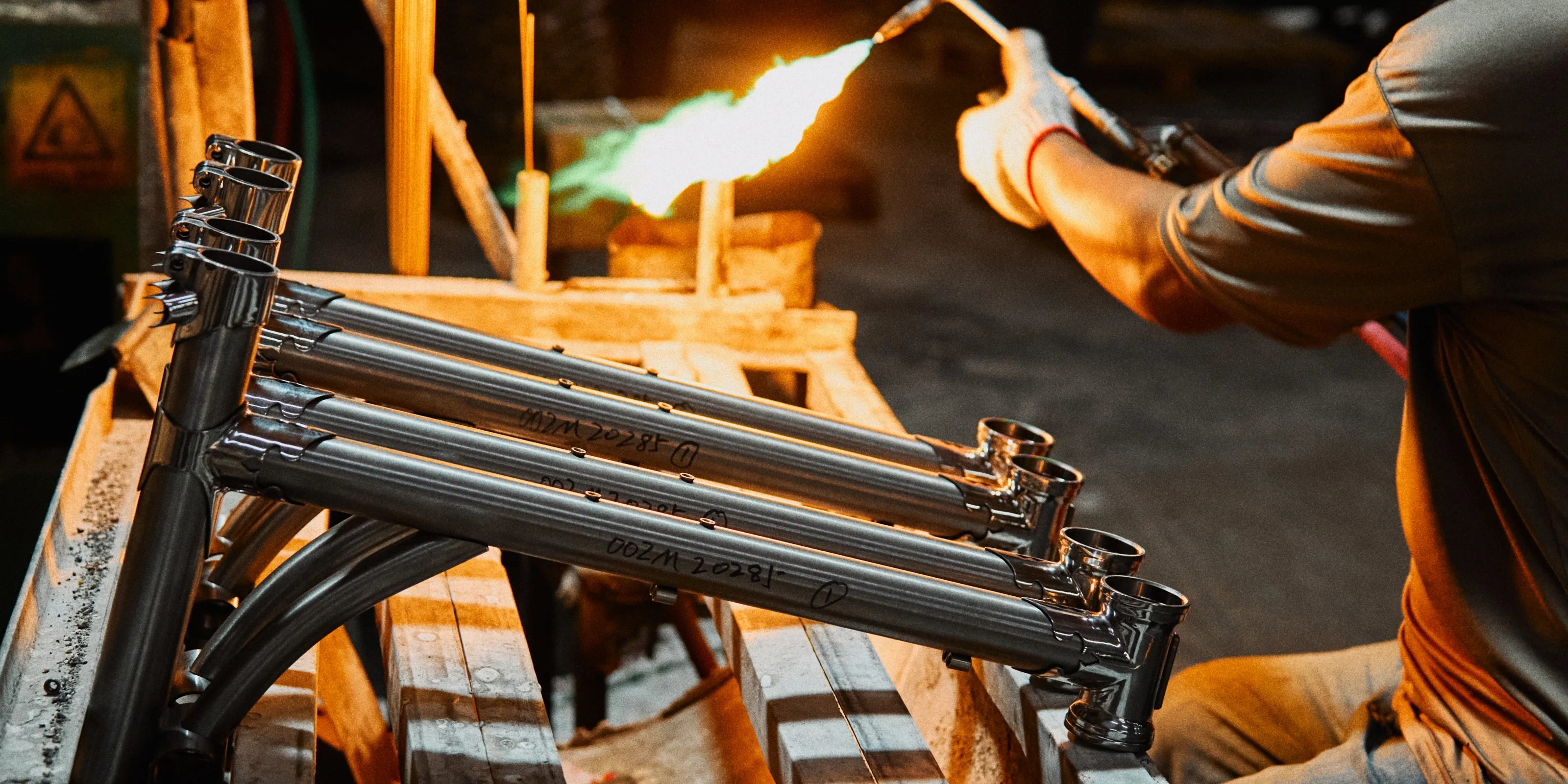 A master craftsman hand-brazing the Rockbros Garvis frame with precision and care.