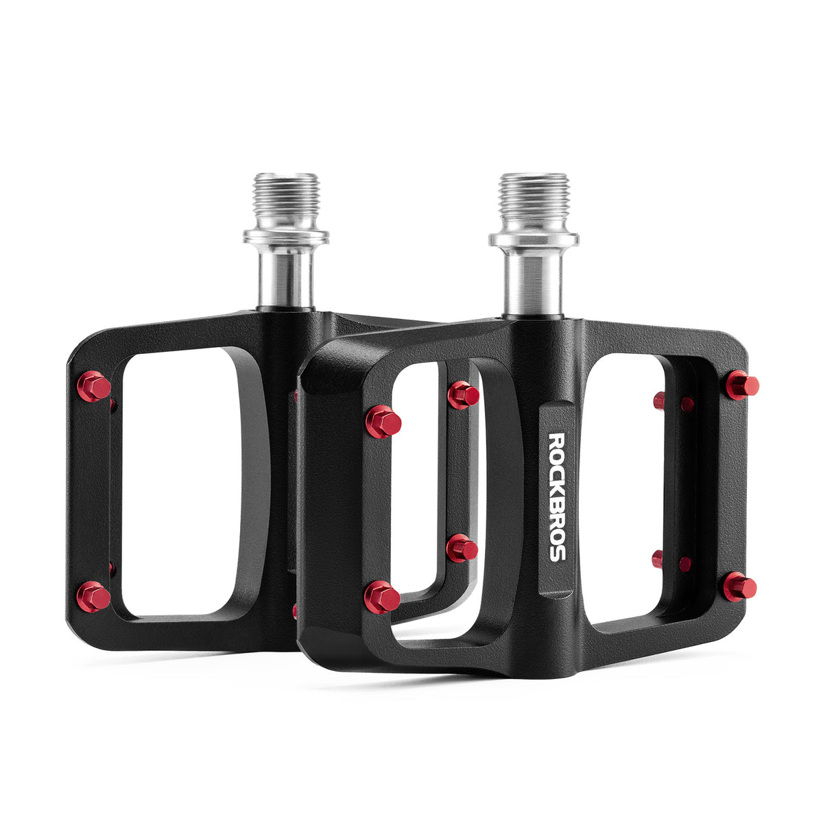Pair of black ROCKBROS flat pedals with red traction pins and silver axles.