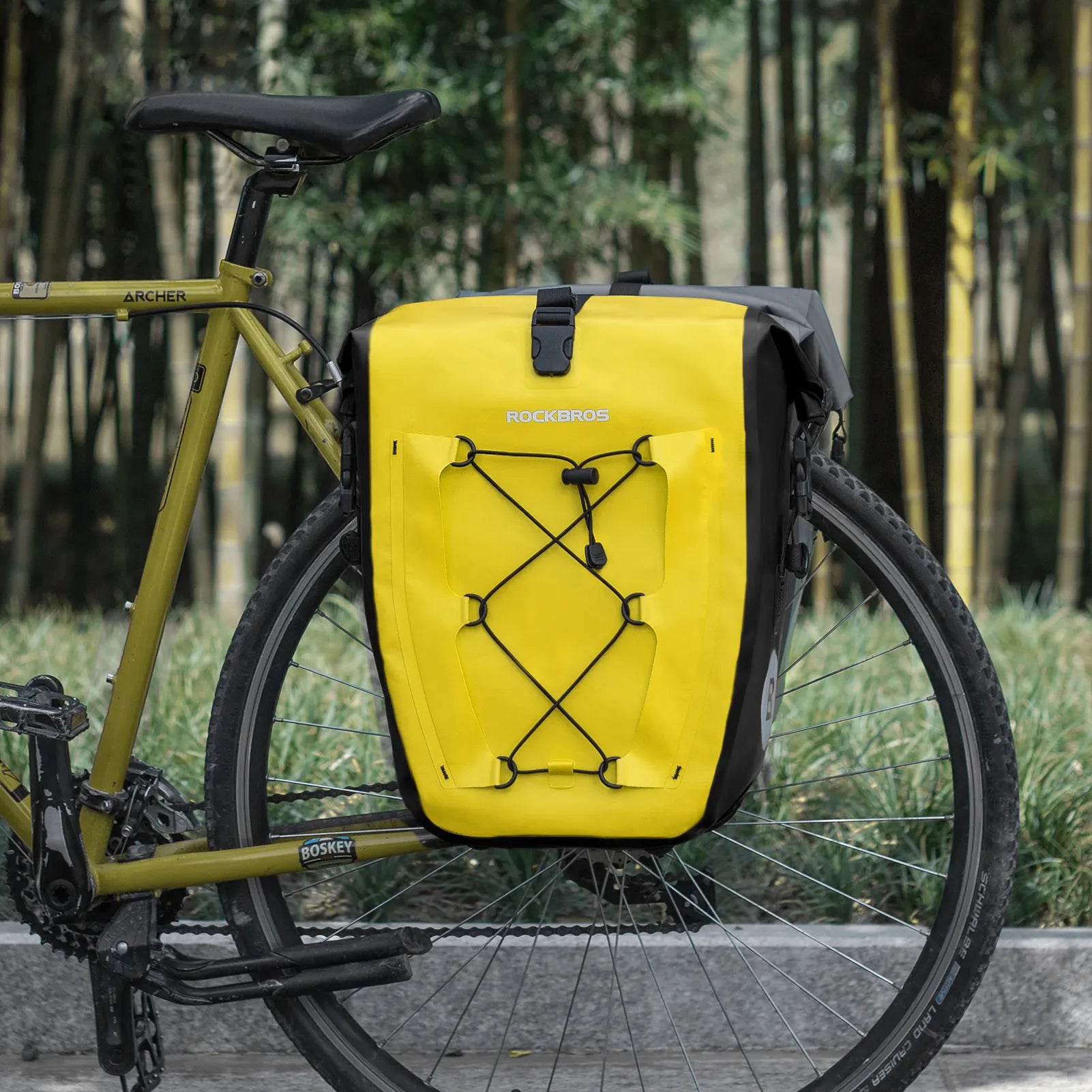 ROCKBROS 25L waterproof bike pannier bag installed on bicycle rear rack for touring and commuting.
#color_yellow