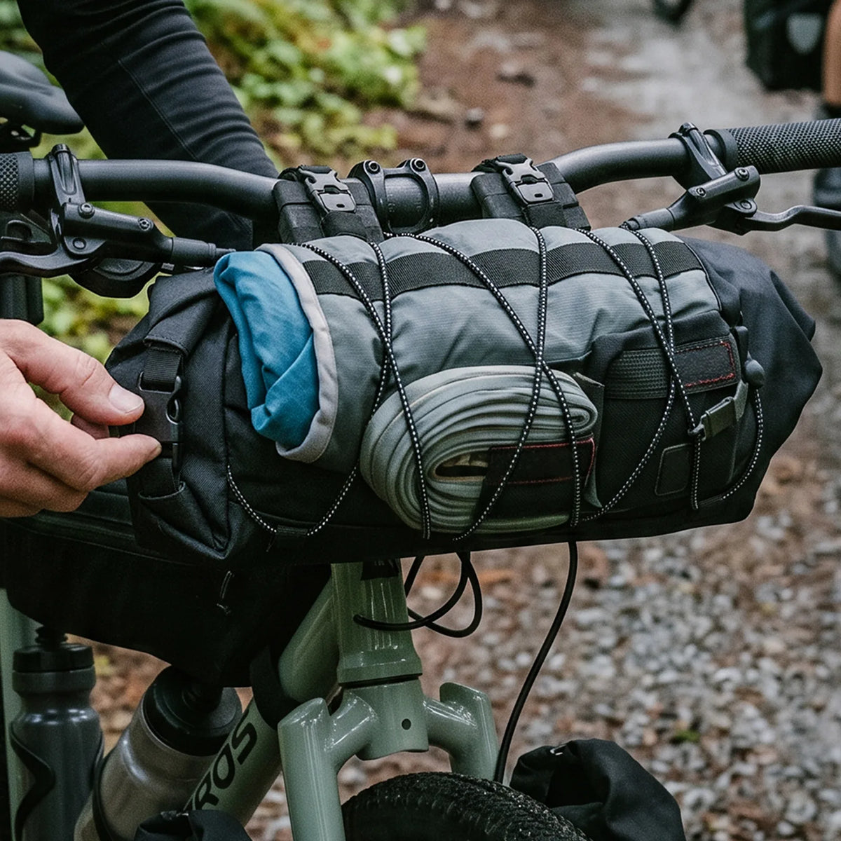 Black ROCKBROS ROAD TO SKY handlebar bag with roll-end closures and external bungee cords